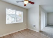 Thumbnail 23 of 46 - Living room with windows at TOWNSHIP Apartments, CANBY, OR