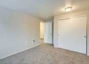 Thumbnail 20 of 46 - Apartments in Canby OR - Township - Empty Bedroom with Plush Carpet and Closet at TOWNSHIP Apartments, CANBY, Oregon