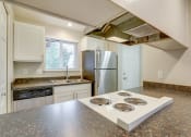 Thumbnail 3 of 46 - Kitchen with appliances at TOWNSHIP Apartments, CANBY