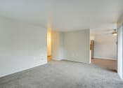Thumbnail 16 of 46 - Living room near patio and kitchen at TOWNSHIP Apartments, CANBY, OR 97013