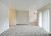 Thumbnail 15 of 46 - Living room near patio and kitchen at TOWNSHIP Apartments, Oregon