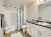 Thumbnail 12 of 46 - Bathroom vanity and shower at TOWNSHIP Apartments, CANBY, Oregon