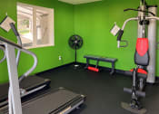 Thumbnail 28 of 28 - Black Floorings, Green Painted Walls, Gym Equipment, and Corner Fan at TOWNSHIP SHERWOOD, Sherwood, OR