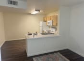 Thumbnail 10 of 14 - a view of a kitchen and a living room in an apartment at VINTAGE AT CITI VISTA, Reno, Nevada