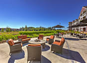 Thumbnail 7 of 25 - Outdoor seating fir pit at VINTAGE AT LAKEWOOD SENIORS Apartments, Washington, 98271