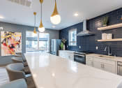 Thumbnail 5 of 19 - Island Kitchen at VINTAGE AT SANCTUARY, RENO, NV
