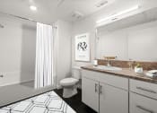 Thumbnail 6 of 9 - a bathroom with a shower toilet and sink at Grand and Linden Family Apartments, South San Francisco, 94080