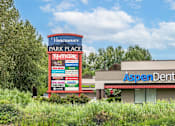 Thumbnail 30 of 37 - A sign for Vancouver Park Place with a T-Mobile store and an Aspen Dental office.at Vancouver Mall Apartments, Vancouver, WA ? 
