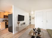 Thumbnail 13 of 37 - Living Room With TV at Vancouver Mall Apartments, Vancouver