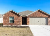 Thumbnail 6 of 33 - a brick house with a white garage door