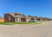 Thumbnail 1 of 11 - Homes Near Fort Worth Zoo- Lasater Ranch - An exterior shot of the single family homes at Lasater Ranch