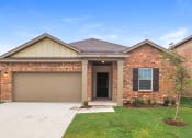 Thumbnail 31 of 32 - a new brick house with a driveway and a garage door