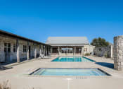 Thumbnail 2 of 33 - Newark TX Dog Friendly Single Family Homes for Rent - Chisholm Springs - Outdoor Pool and Spa with Stone Walls and Decoration