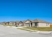 Thumbnail 1 of 33 - a row of houses on the side of a street