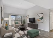 Thumbnail 6 of 14 - Stratford Wood Apartments and Townhomes in Minnetonka, MN Photo of the living room of an apartment with couches and a tv
