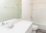 Thumbnail 15 of 32 - a bathroom with a sink toilet and a shower