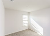 Thumbnail 28 of 33 - an empty room with white walls and a window