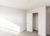 Thumbnail 29 of 33 - an empty room with a white door and a closet