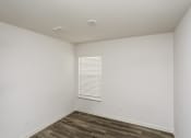 Thumbnail 16 of 33 - an empty room with white walls and a window