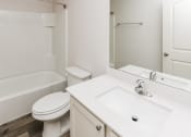 Thumbnail 32 of 33 - a bathroom with a sink toilet and a mirror