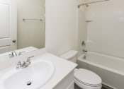 Thumbnail 27 of 32 - a bathroom with a sink toilet and a tub