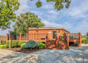 Thumbnail 12 of 12 - Treetop Lodge Apartments in Overland Park, KS photo of outside of clubhouse