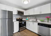 Thumbnail 1 of 13 - Wilton Tower apartments in Wilton Manors Florida photo of kitchen with stainless steel appliances