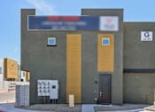 Thumbnail 45 of 45 - A building with a blue sign on the top and a number 43-49 on the right side.