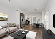 Thumbnail 5 of 30 - Spacious living area at MB Station apartments featuring modern finishes, abundant natural light, and a comfortable open floor plan near Coral Gables and Downtown Miami.