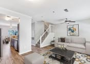 Thumbnail 6 of 12 - One K Apartments in Atlanta, GA photo of a living room with a couch and a table