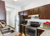Thumbnail 5 of 12 - One K Apartments in Atlanta, GA photo of our apartments offer a modern kitchen with stainless steel appliances