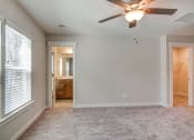 Thumbnail 12 of 25 - Dog-Friendly Homes for Rent in North Charleston, SC - Sumner Village - Bedroom with Plush Carpet Flooring, Ceiling Fan, Spacious Closet, Attached Bathroom, and Large Windows.