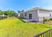 Thumbnail 61 of 62 - a 3d rendering of a house with a green fence