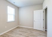 Thumbnail 10 of 62 - an empty room with a white door and a window