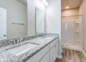 Thumbnail 13 of 62 - a bathroom with two sinks and a large mirror