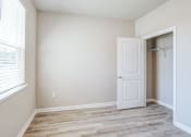 Thumbnail 49 of 62 - an empty bedroom with a closet and a window