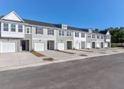 Thumbnail 1 of 45 - Townhomes For Rent In North Charleston, SC - Highland Townhomes - Exterior View Of Car Garage And Property