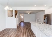 Thumbnail 43 of 45 - an empty kitchen with a counter top and a sink
