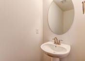 Thumbnail 33 of 45 - a small bathroom with a sink and a mirror