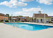 Thumbnail 22 of 40 - Resort-style swimming pool with sundeck at Reserve at Drakes Creek Apartments