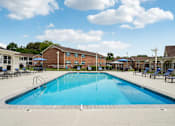Thumbnail 2 of 40 - Resort-style swimming pool with sundeck at Reserve at Drakes Creek Apartments