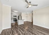 Thumbnail 13 of 48 - Contemporary Hawks Landing apartment kitchen showcasing stainless-steel appliances and an open-concept island