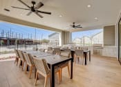 Thumbnail 42 of 56 - a large patio with a dining table and chairs