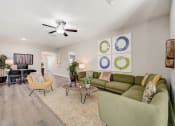 Thumbnail 10 of 29 - Lady Lake, FL Rentals – The Groves at Lake Ella - a living room with couches and chairs and a ceiling fan