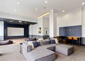 Thumbnail 24 of 29 - resident lounge with movie screen and seating