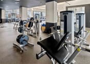 Thumbnail 18 of 29 - fitness center with strength training equipment