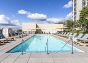 Thumbnail 11 of 29 - Rooftop pool with lounge chairs