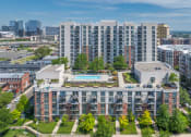 Thumbnail 43 of 46 - an aerial view of a building with a pool in the middle