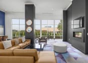 Thumbnail 6 of 46 - a living room with leather furniture and a fireplace