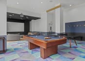 Thumbnail 15 of 46 - a game room with a pool table and a ping pong table